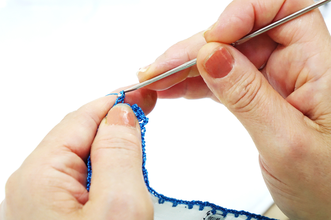 crochet work of a crochet clutch bag in pure Italian linen batiste DM Ties